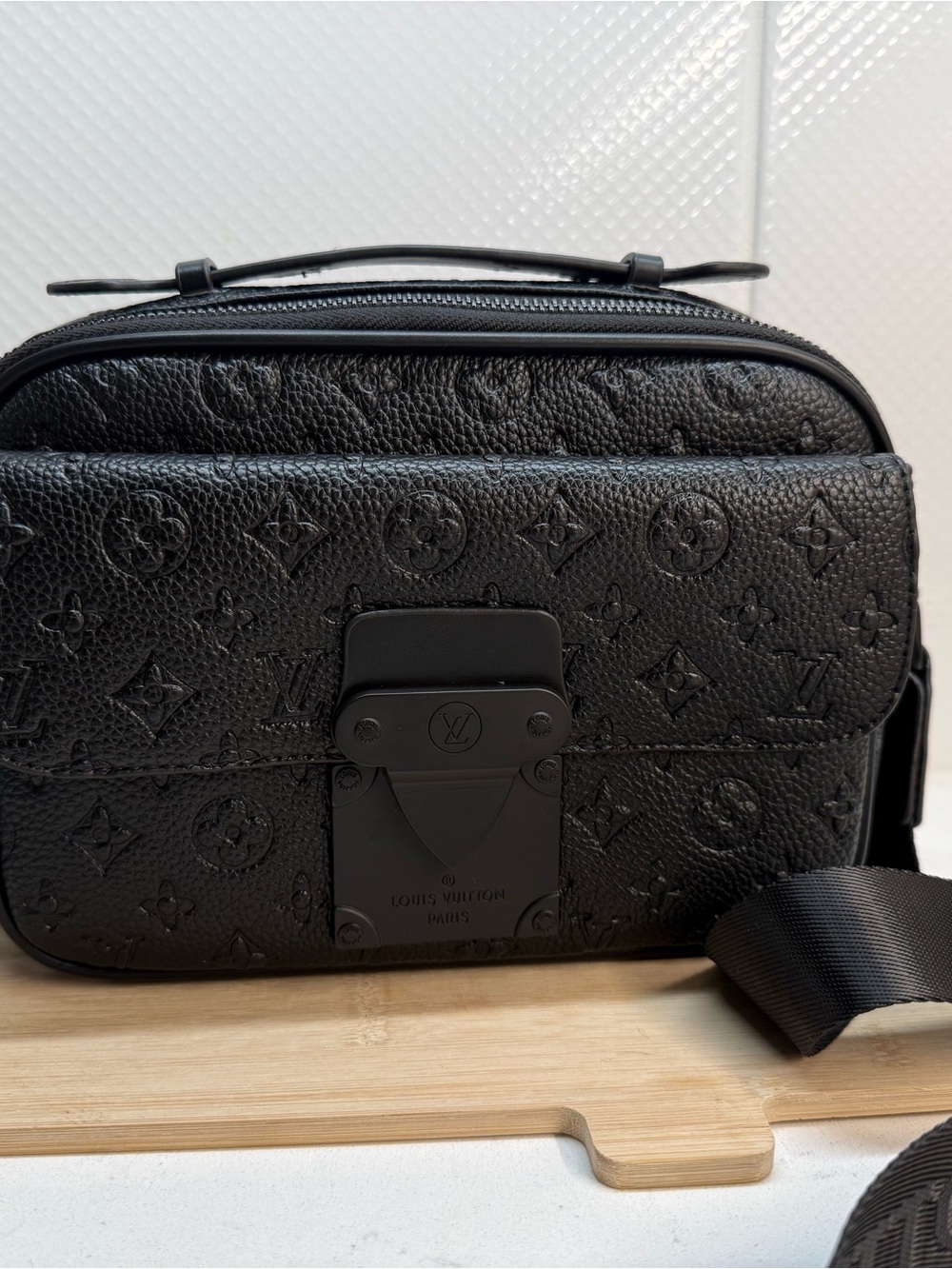 Black Embossed leather Monogram Messenger Bag